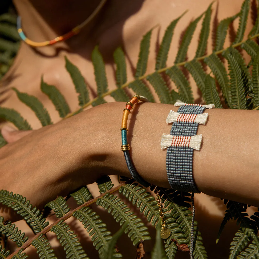 Adjustable beaded bracelet with tassels