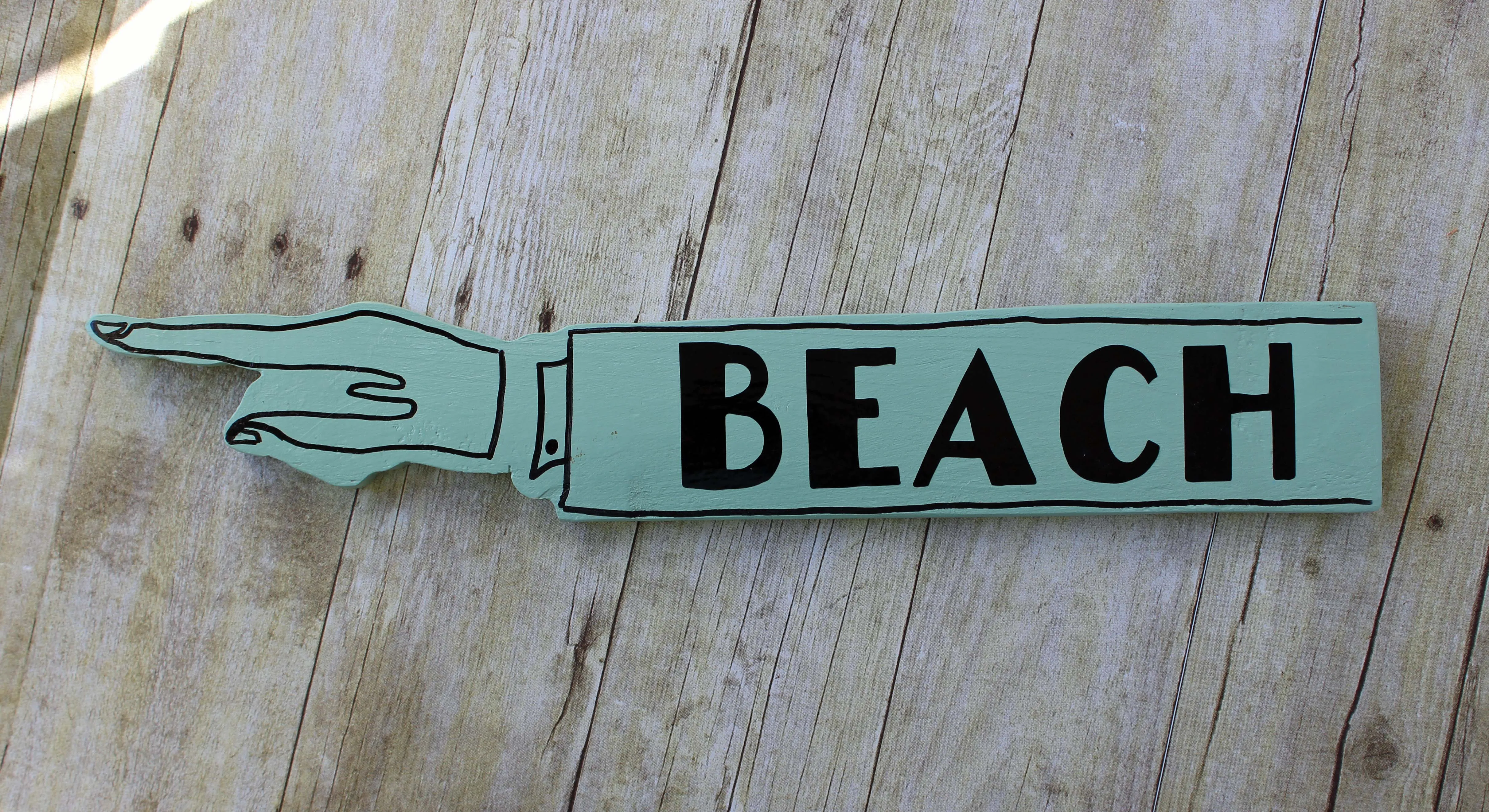 beach wooden pointy sign