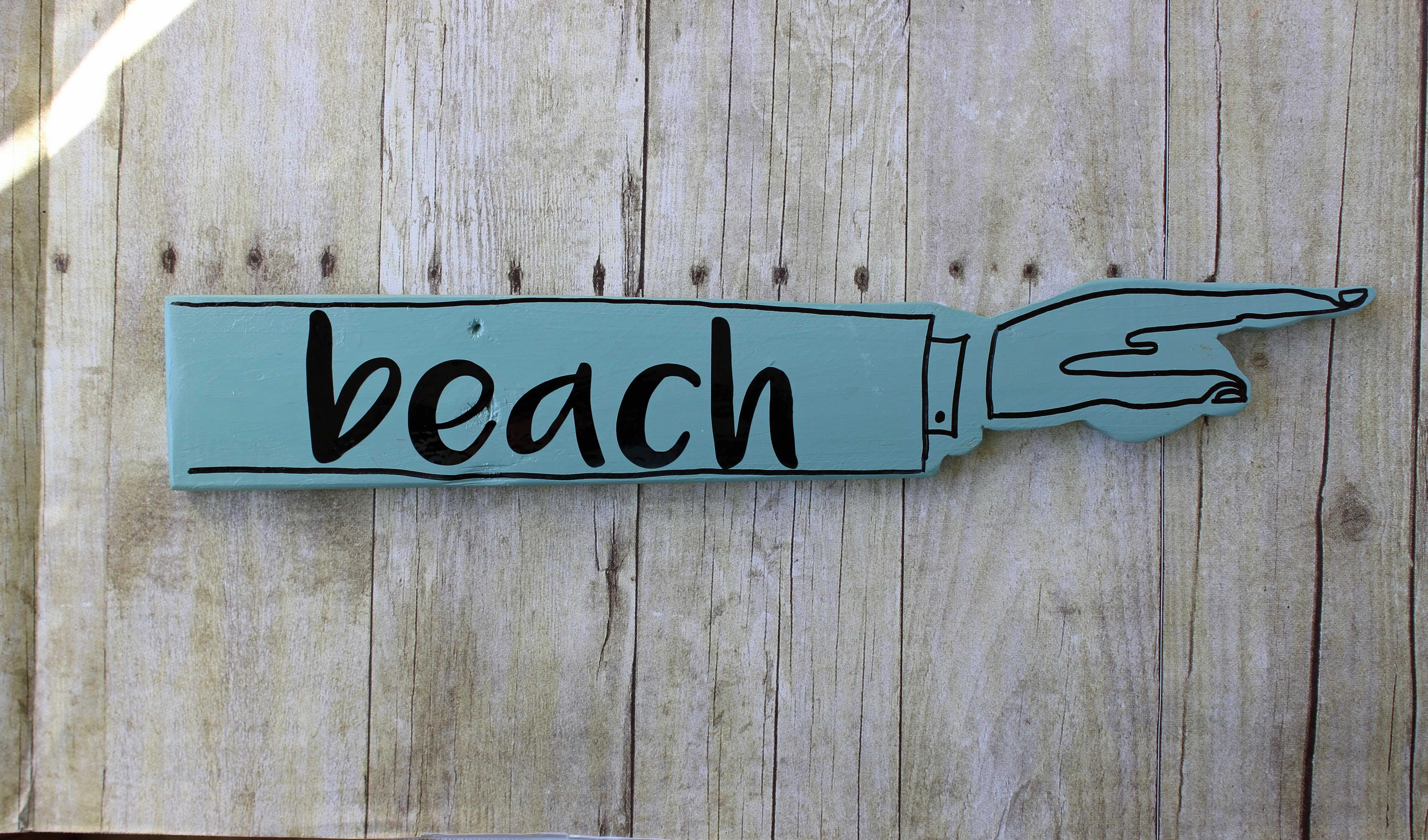 beach wooden pointy sign