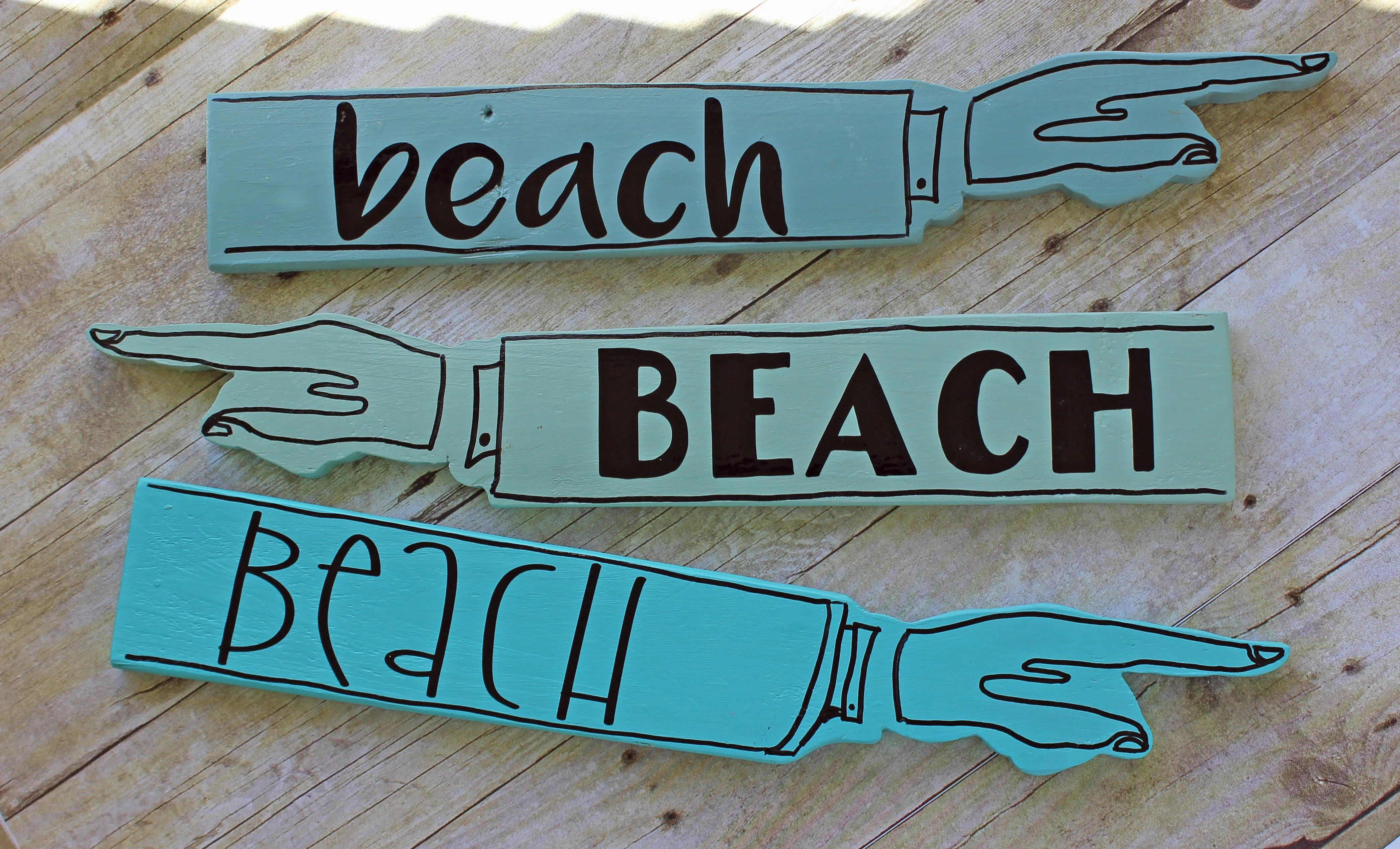 beach wooden pointy sign