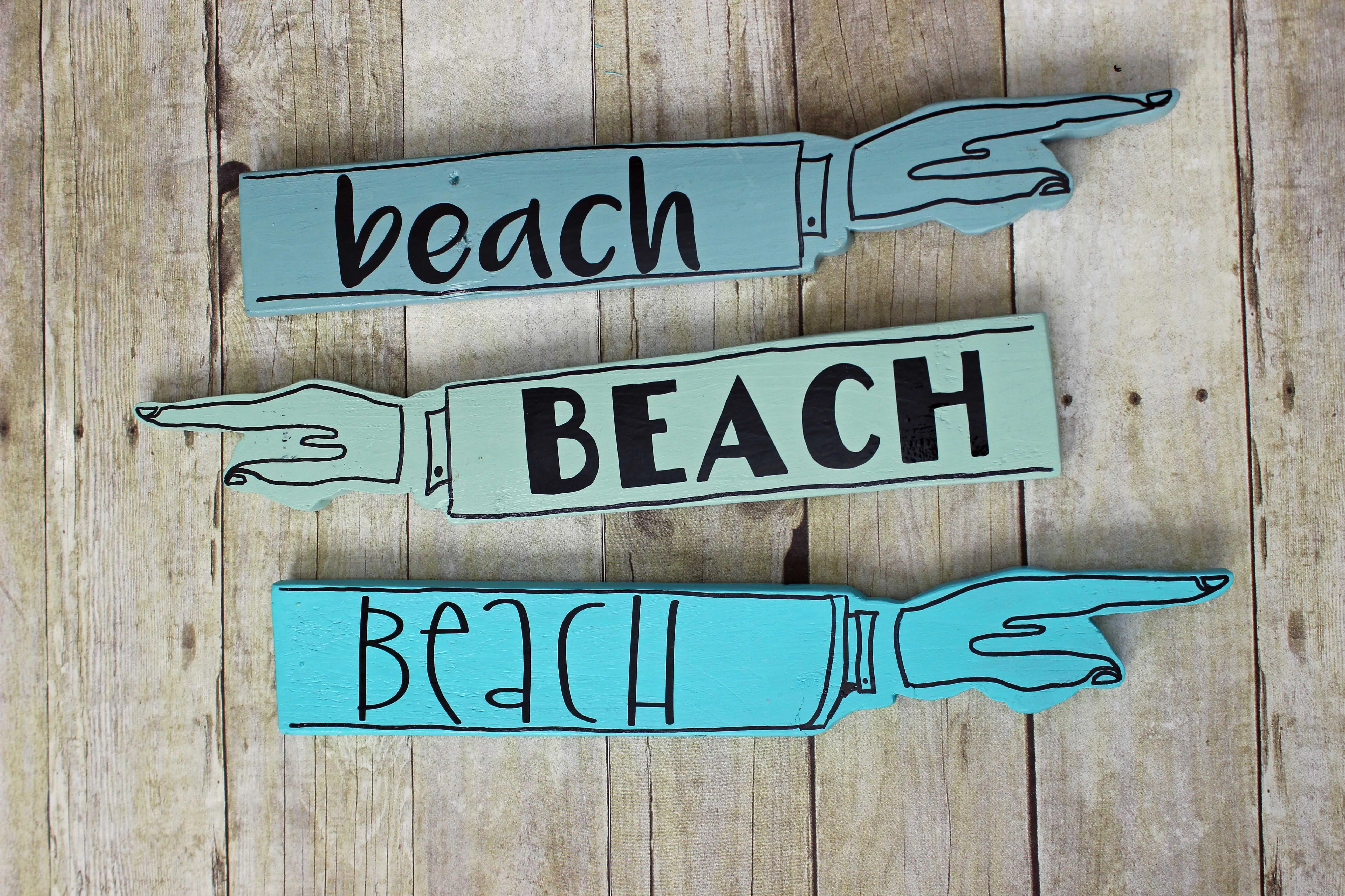 beach wooden pointy sign